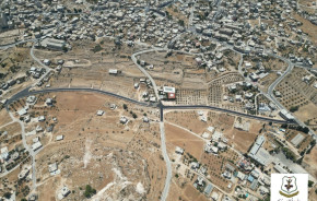 بالصور| أعمال تعبيد شارع رابط أبو هوى بطول 760 مترًا